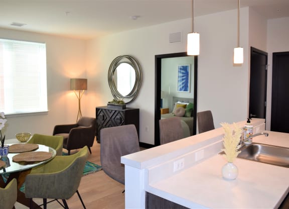 Image of a Kitchen Island and Living Room| Terraces at Arlington View | Affordable Arlington Apartments